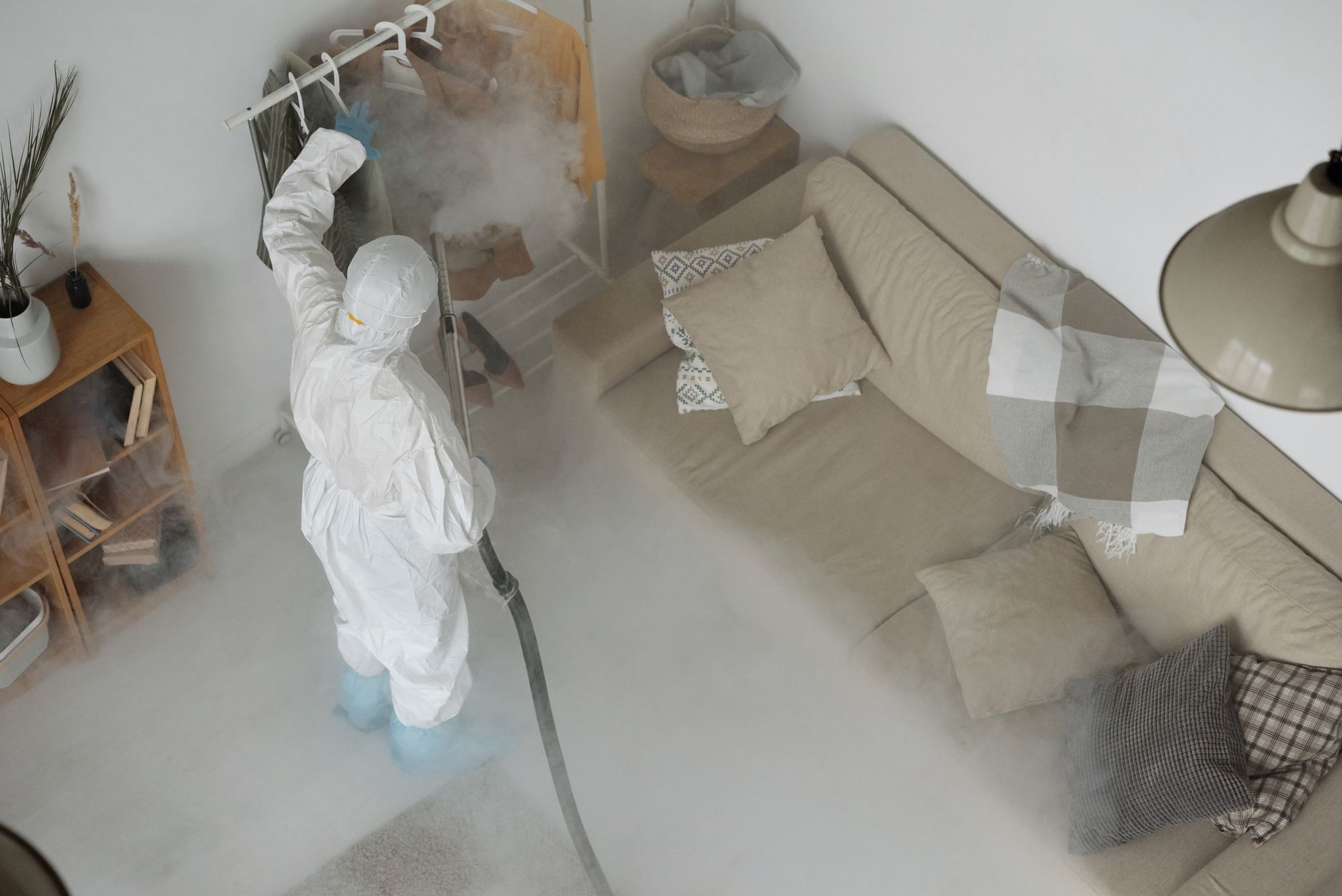 Technician in protective equipment carrying out treatment