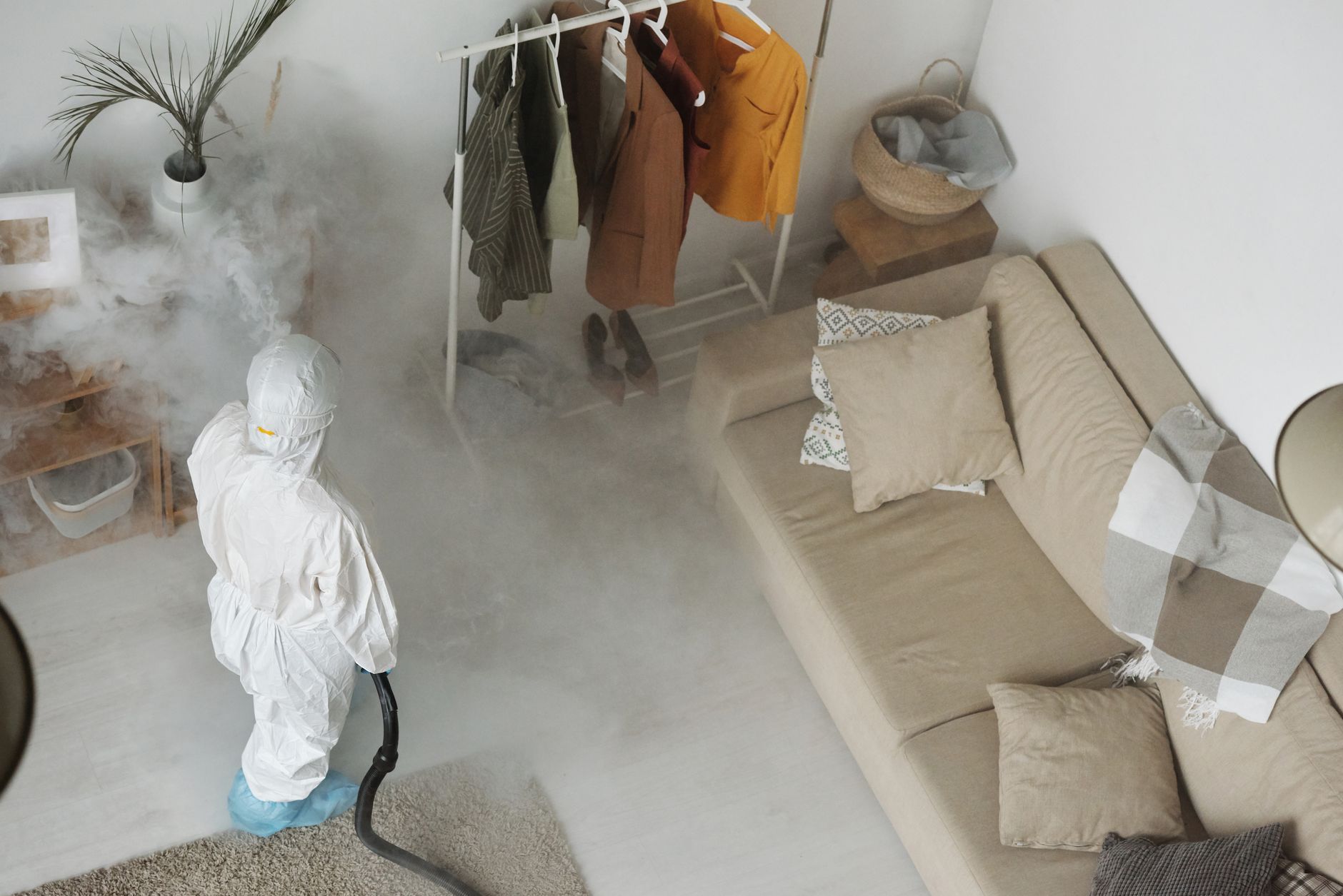 Certified technician treating a home for pests